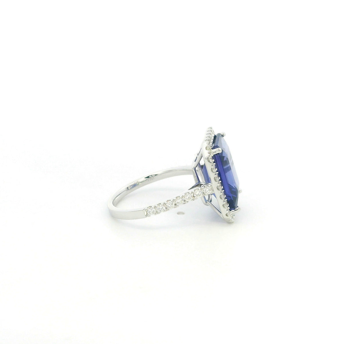 8.20 carat emerald cut tanzanite and diamond halo ring in 18K white gold