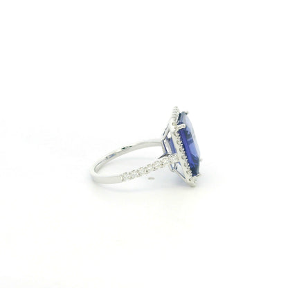8.20 carat emerald cut tanzanite and diamond halo ring in 18K white gold