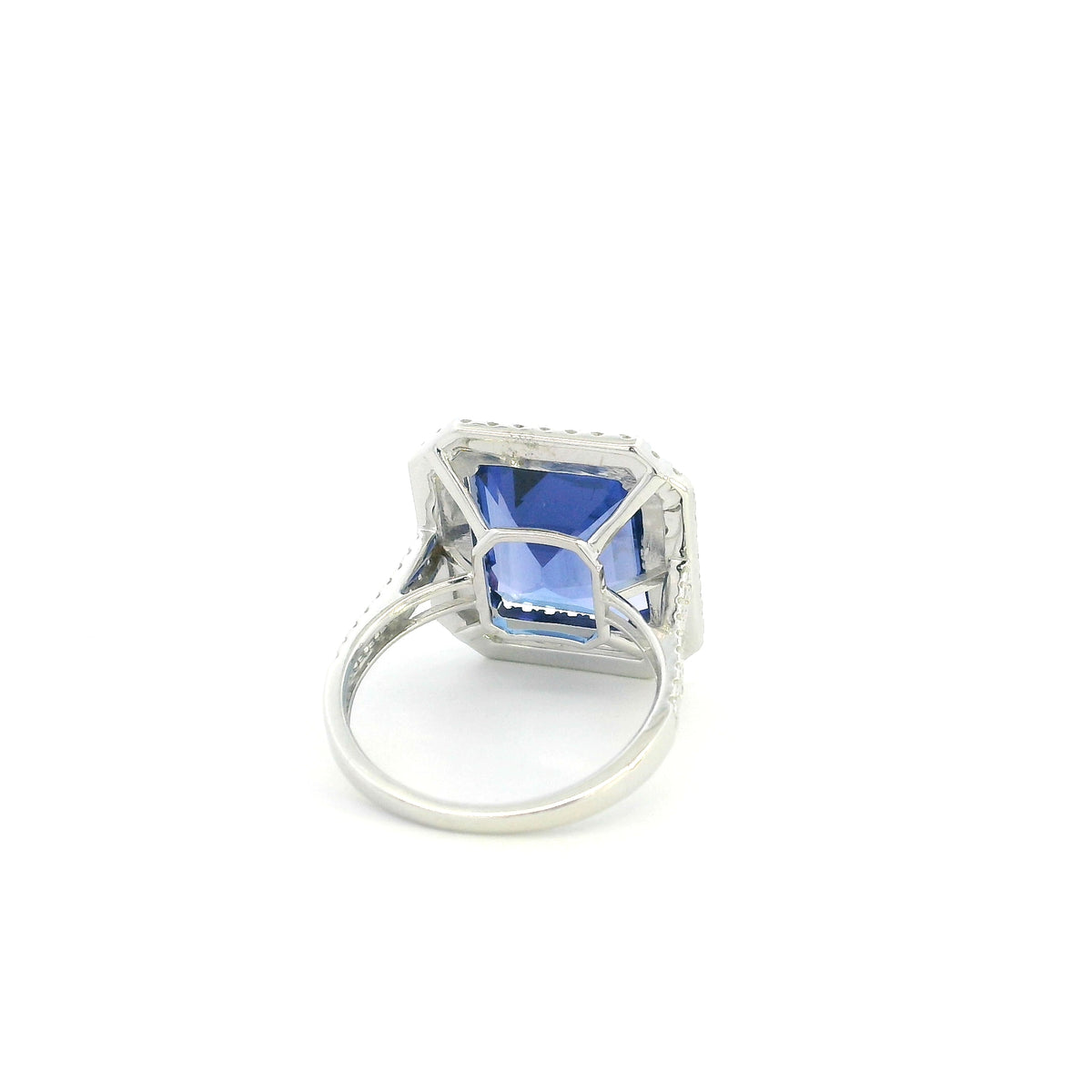 18K white gold tanzanite and diamond double halo statement ring with rectangular blue-violet tanzanite and diamond-set band