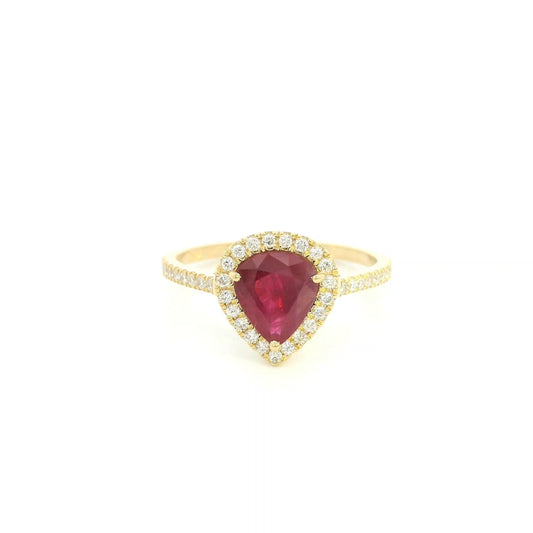 Pear shaped ruby and diamond halo ring in 18K yellow gold with diamond-set shoulders