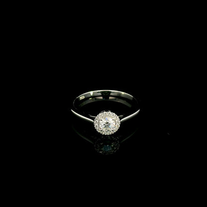 Round diamond halo engagement ring in 18K white gold