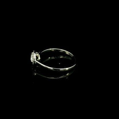 Round diamond halo engagement ring in 18K white gold
