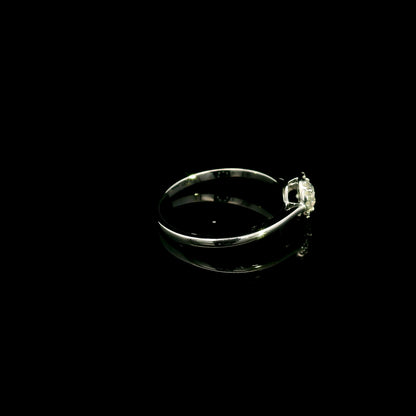 Round diamond halo engagement ring in 18K white gold