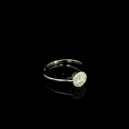 Round diamond halo engagement ring in 18K white gold