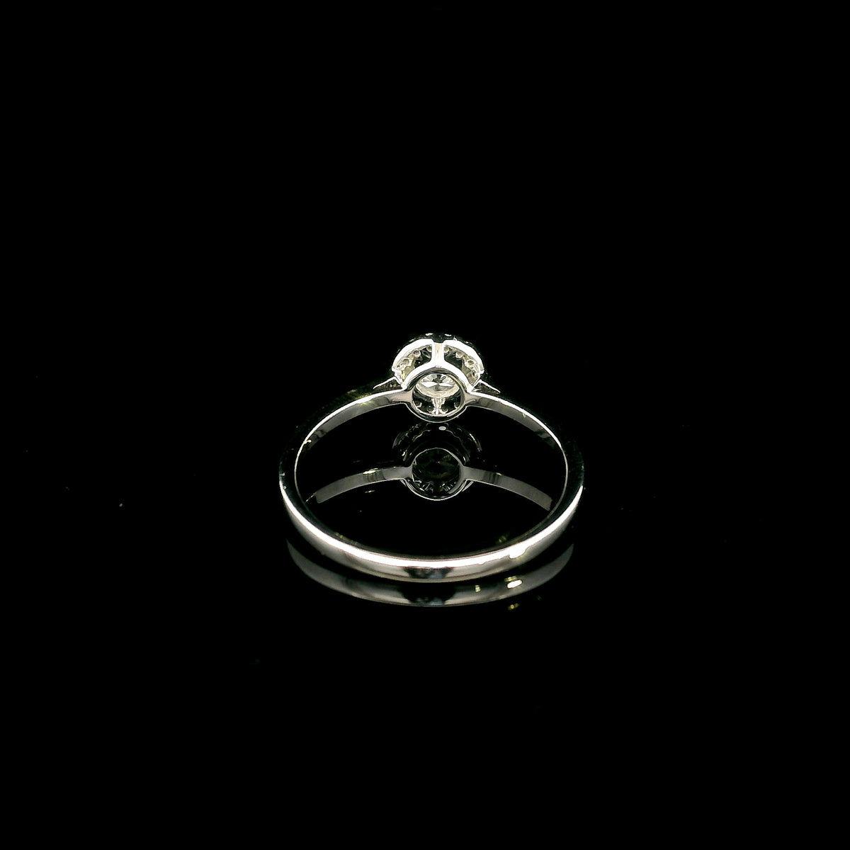 Round diamond halo engagement ring in 18K white gold