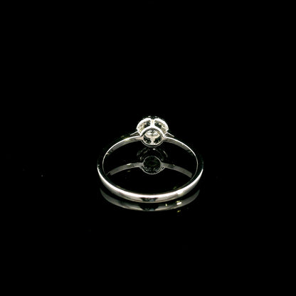 Round diamond halo engagement ring in 18K white gold