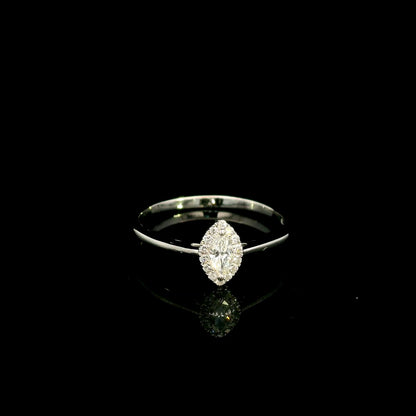 Marquise diamond halo engagement ring in 18K white gold featuring a marquise centre diamond surrounded by a fine round diamond halo.