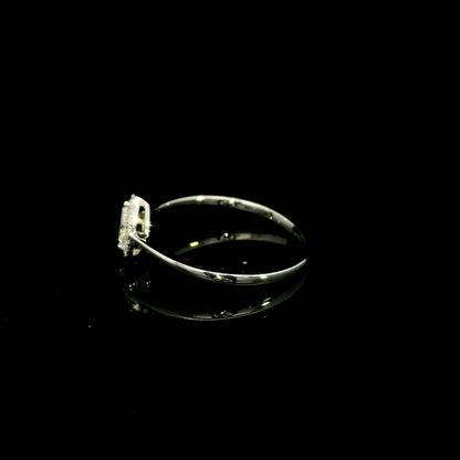 Marquise diamond halo engagement ring in 18K white gold featuring a marquise centre diamond surrounded by a fine round diamond halo.
