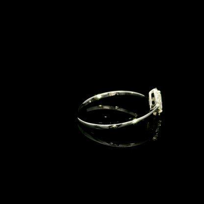 Marquise diamond halo engagement ring in 18K white gold featuring a marquise centre diamond surrounded by a fine round diamond halo.