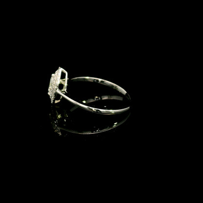 Marquise diamond halo engagement ring in 18K white gold with a marquise centre diamond surrounded by a sparkling diamond halo.
