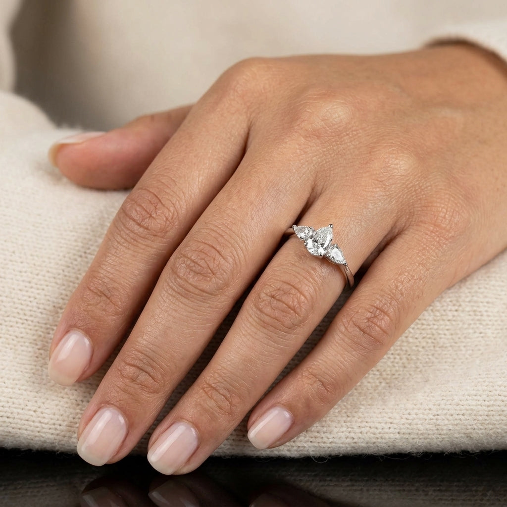 Pear shaped three stone diamond engagement ring in 18K white gold
