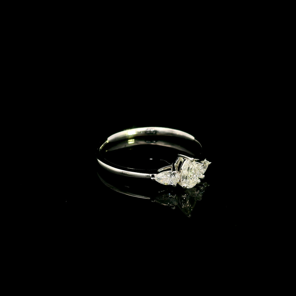 Pear shaped three stone diamond engagement ring in 18K white gold