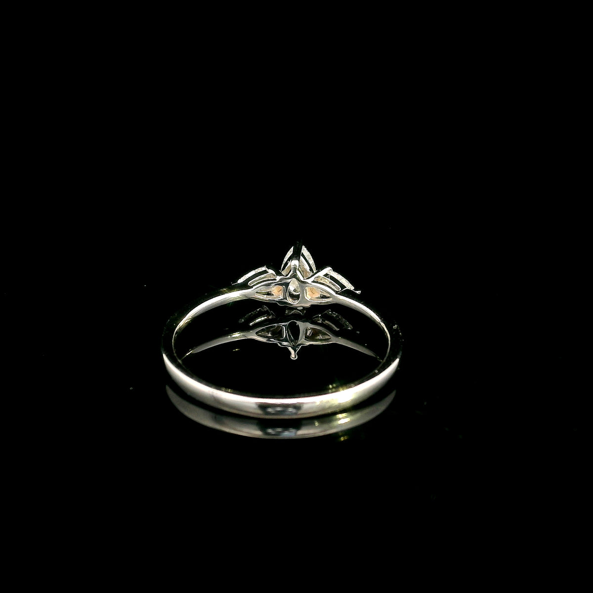 Pear shaped three stone diamond engagement ring in 18K white gold