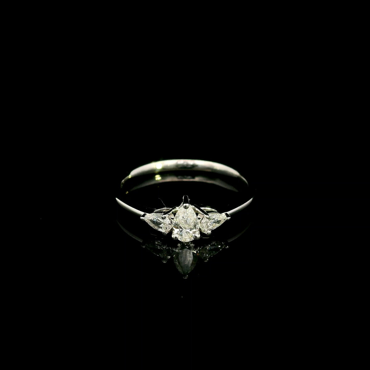 Pear shaped three stone diamond engagement ring in 18K white gold