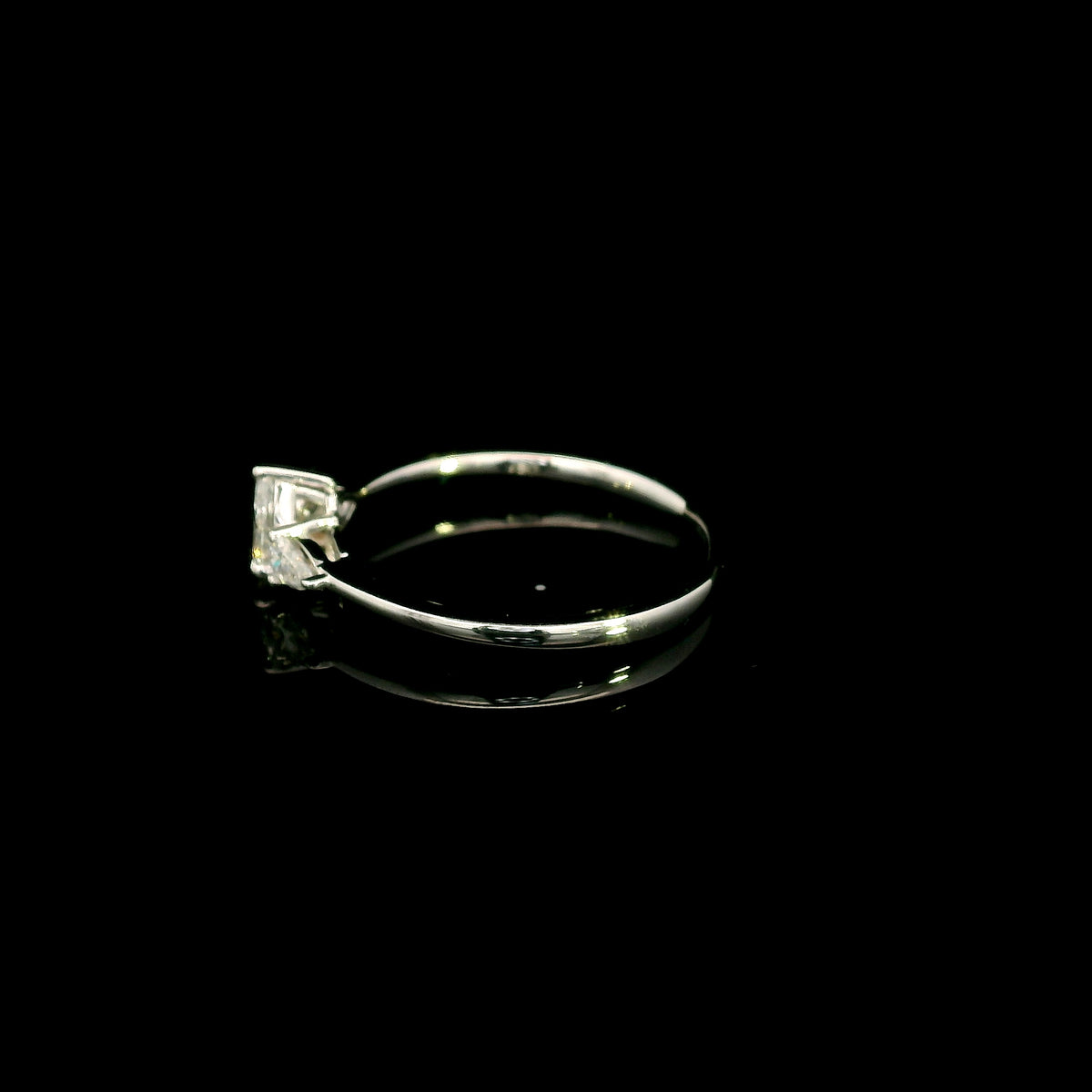 Pear shaped three stone diamond engagement ring in 18K white gold