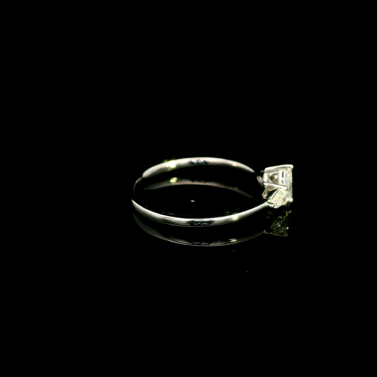 Pear shaped three stone diamond engagement ring in 18K white gold