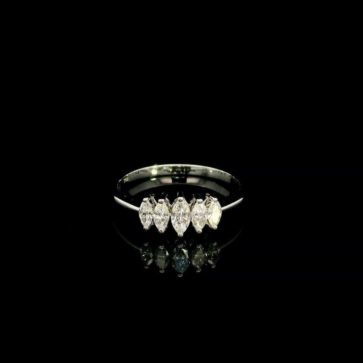 18K white gold five stone marquise diamond ring with five marquise cut diamonds set across the finger