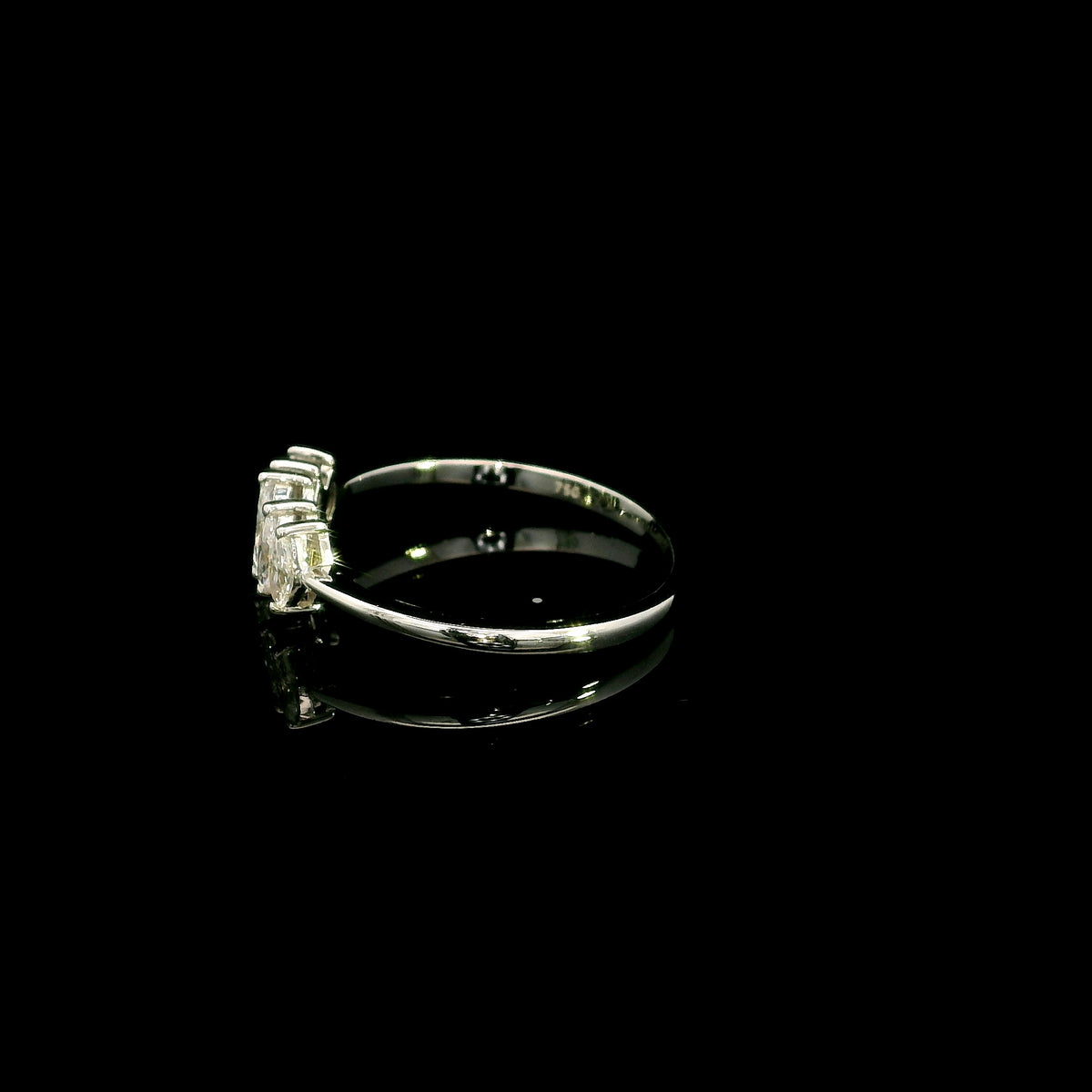 18K white gold five stone marquise diamond ring with five marquise cut diamonds set across the finger