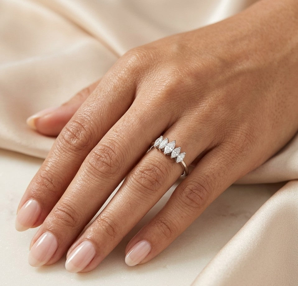 18K white gold five stone marquise diamond ring with five marquise cut diamonds set across the finger