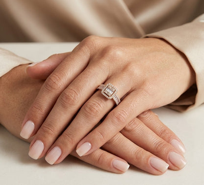 18K rose gold statement ring featuring baguette and round diamonds in a rectangular geometric design