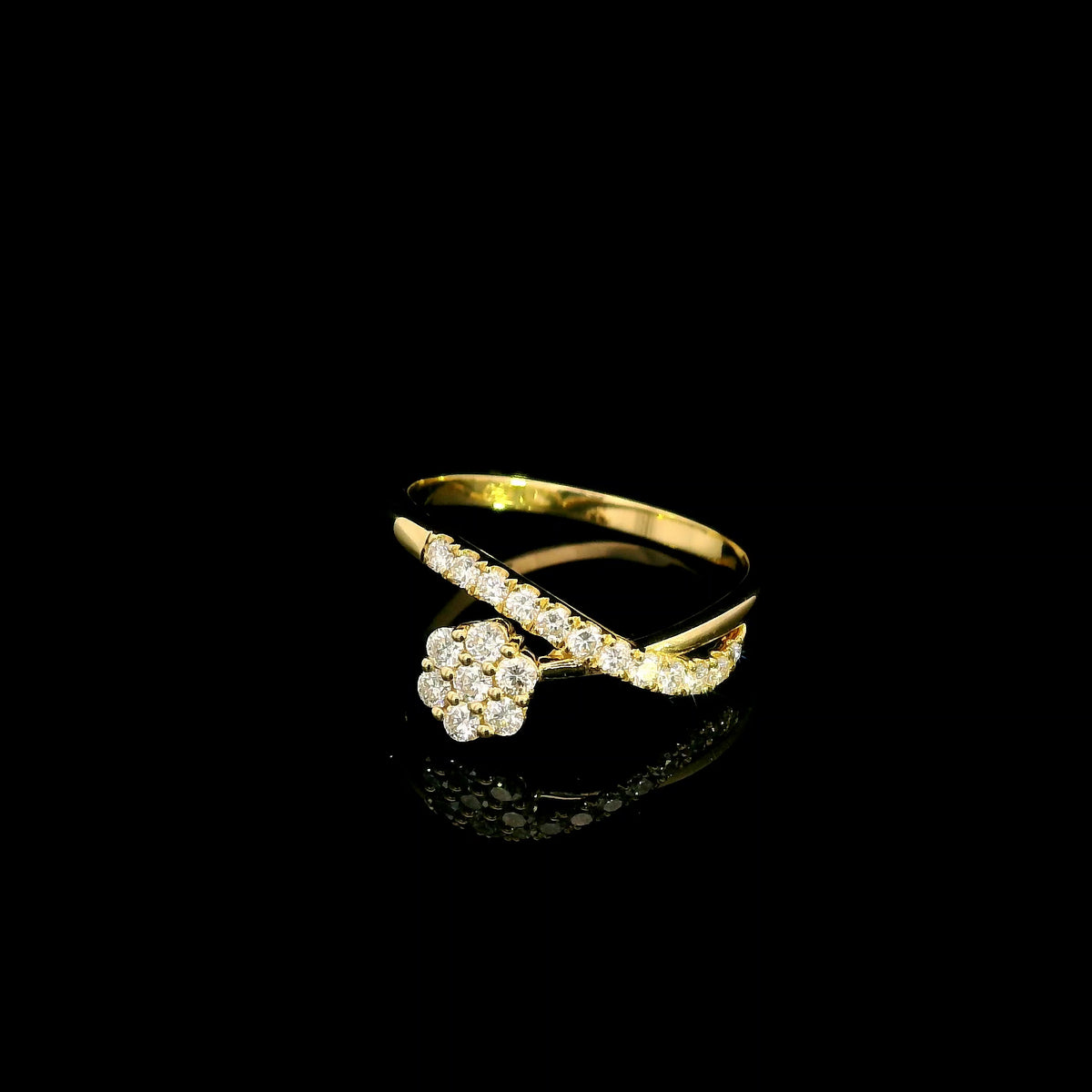 Diamond cluster crossover ring with round diamonds in 18K yellow gold by Emirates Diamonds