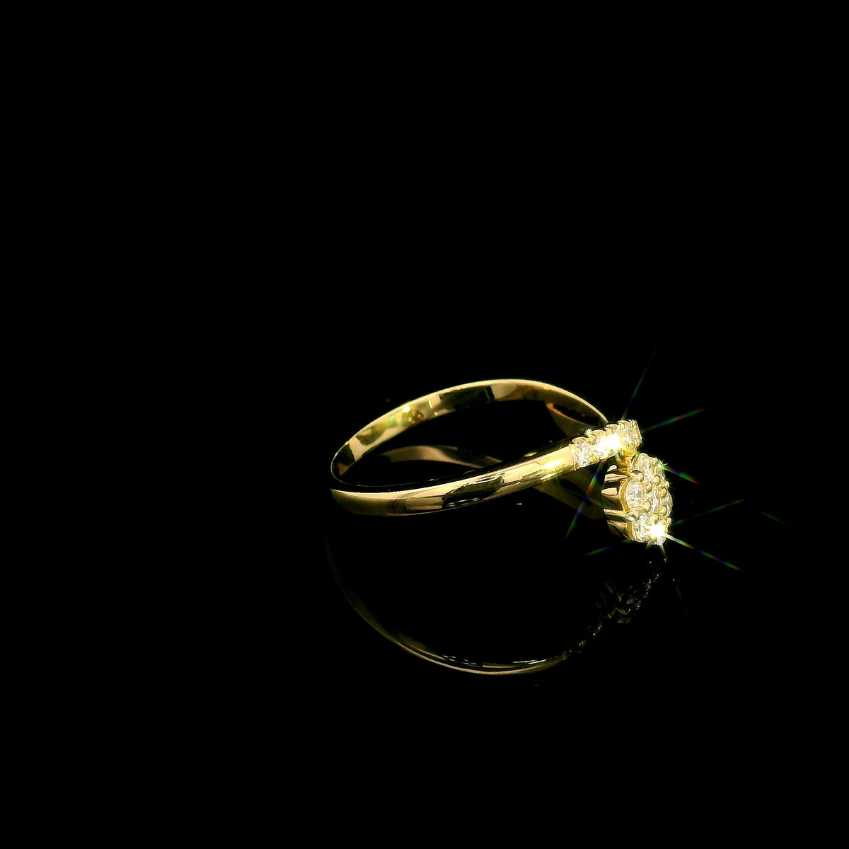 Diamond cluster crossover ring with round diamonds in 18K yellow gold by Emirates Diamonds