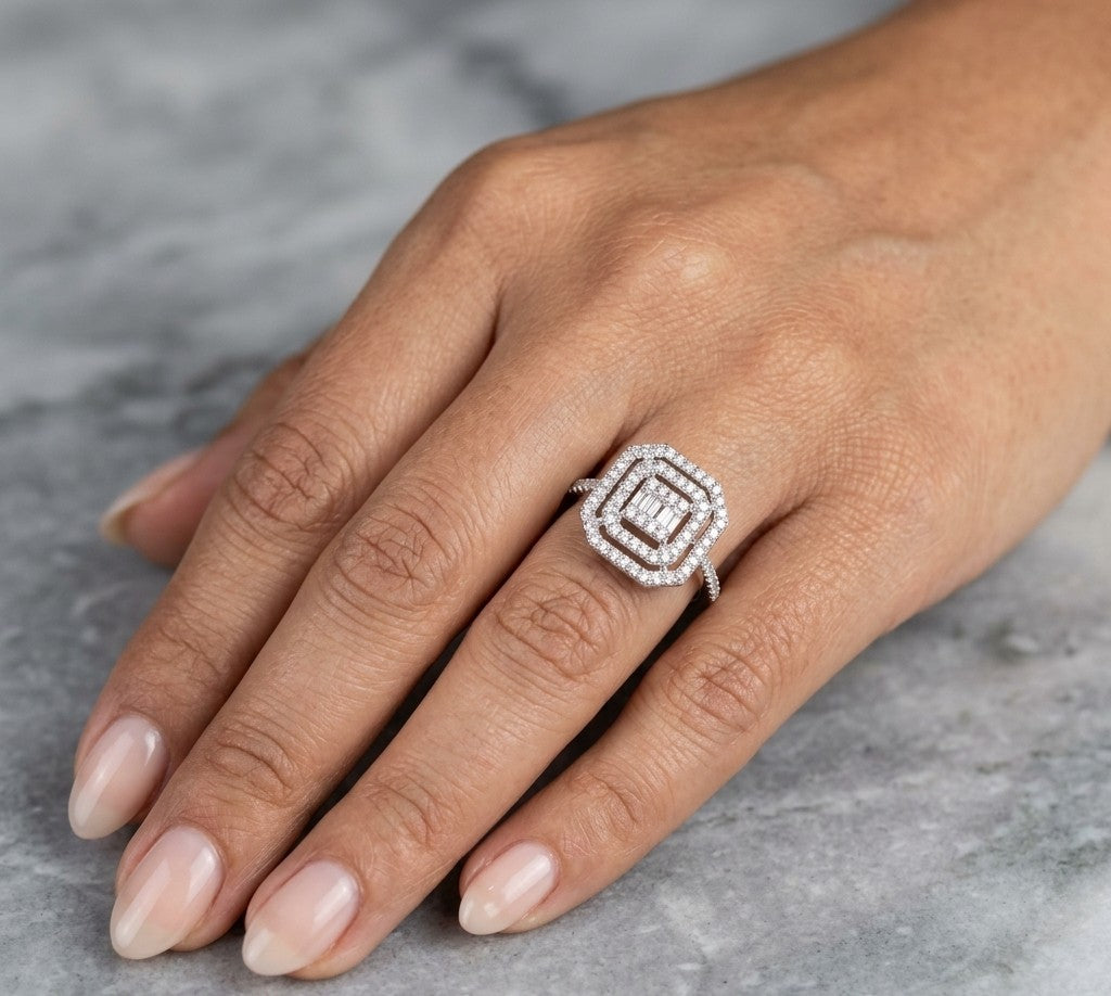 Baguette and round diamond halo ring in 18K white gold