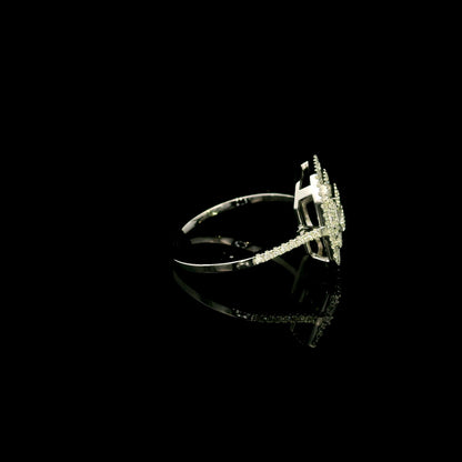 Baguette and round diamond halo ring in 18K white gold