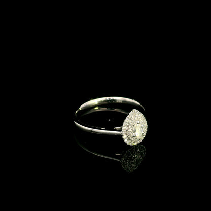 Pear shaped diamond halo ring in 18K white gold with round diamond halo