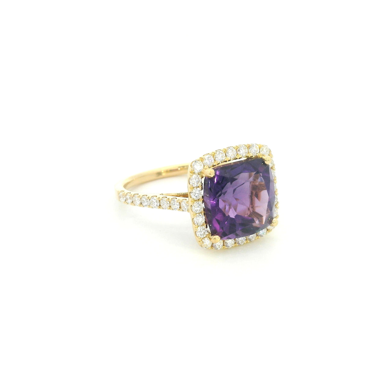 18K yellow gold cushion amethyst and diamond halo ring with purple amethyst, round diamond surround and diamond-set band