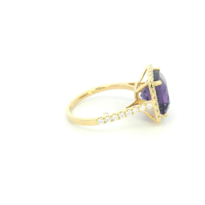 18K yellow gold cushion amethyst and diamond halo ring with purple amethyst, round diamond surround and diamond-set band