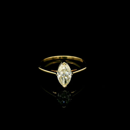 Marquise diamond solitaire engagement ring in 18K yellow gold with an IGI certified natural diamond.
