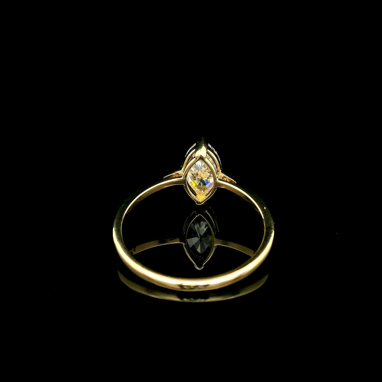 Marquise diamond solitaire engagement ring in 18K yellow gold with an IGI certified natural diamond.
