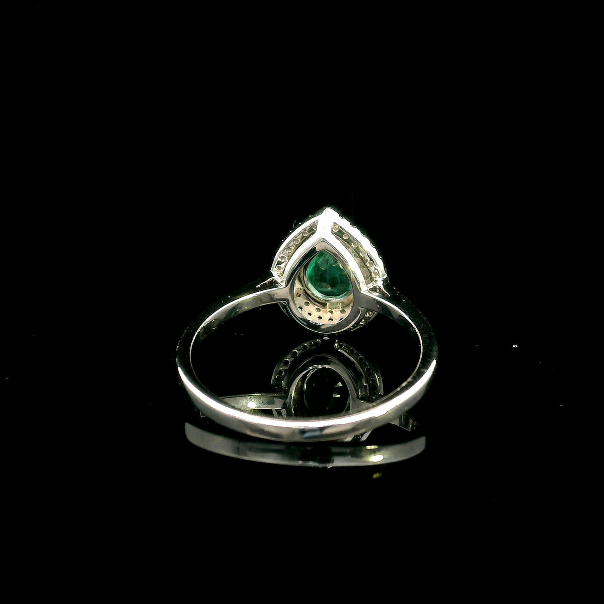 18K white gold pear shaped emerald and diamond halo ring with green emerald surrounded by round diamonds