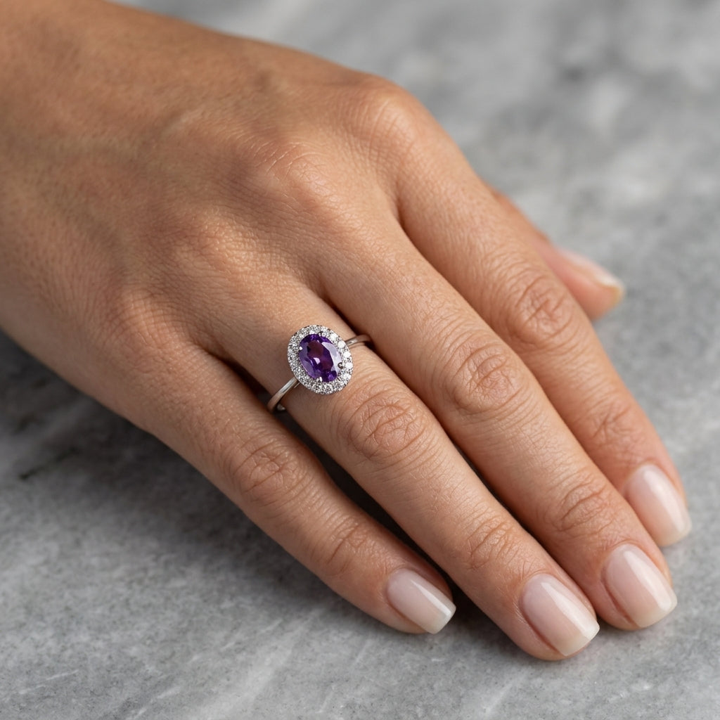 Oval amethyst ring with diamond halo in 18K white gold