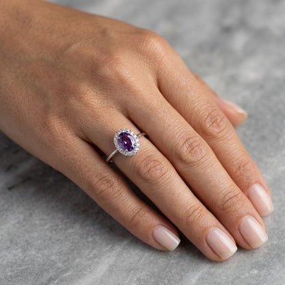 Oval amethyst ring with diamond halo in 18K white gold
