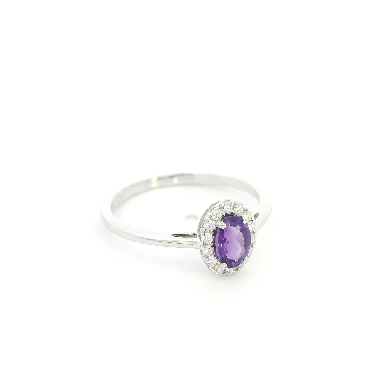 Oval amethyst ring with diamond halo in 18K white gold
