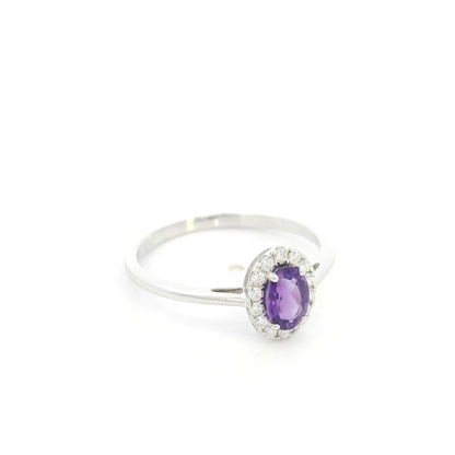 Oval amethyst ring with diamond halo in 18K white gold