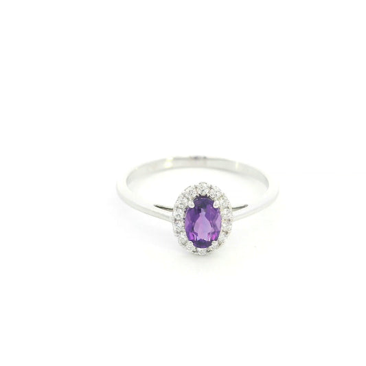 Oval amethyst ring with diamond halo in 18K white gold