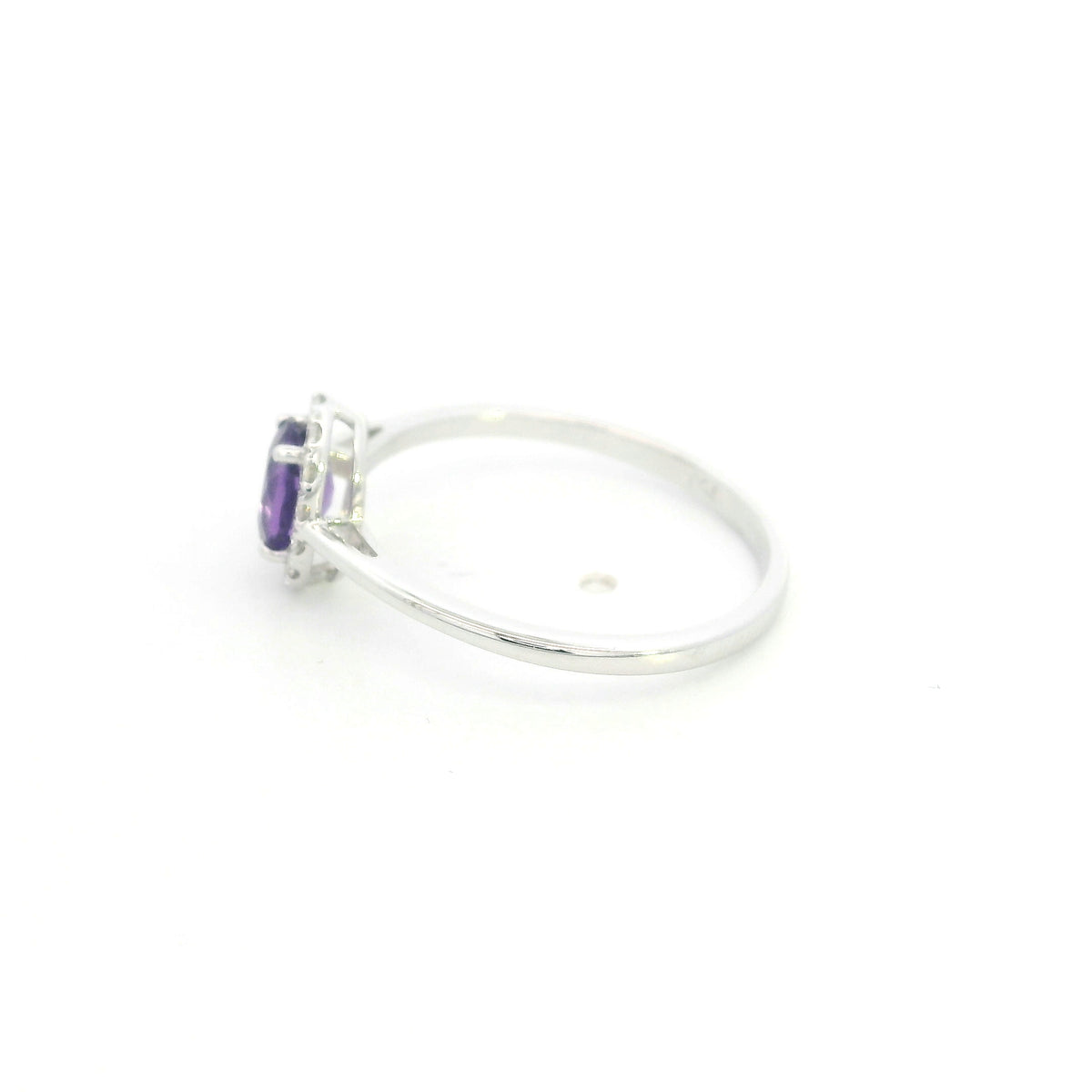 Oval amethyst ring with diamond halo in 18K white gold