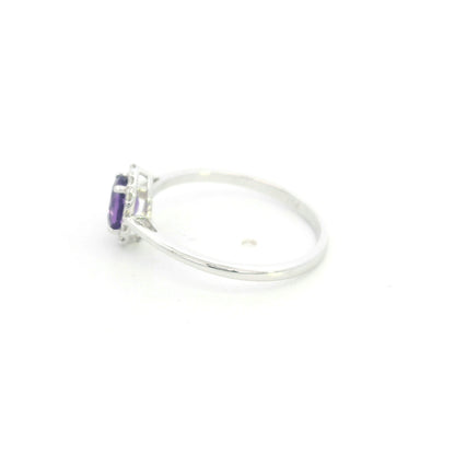Oval amethyst ring with diamond halo in 18K white gold