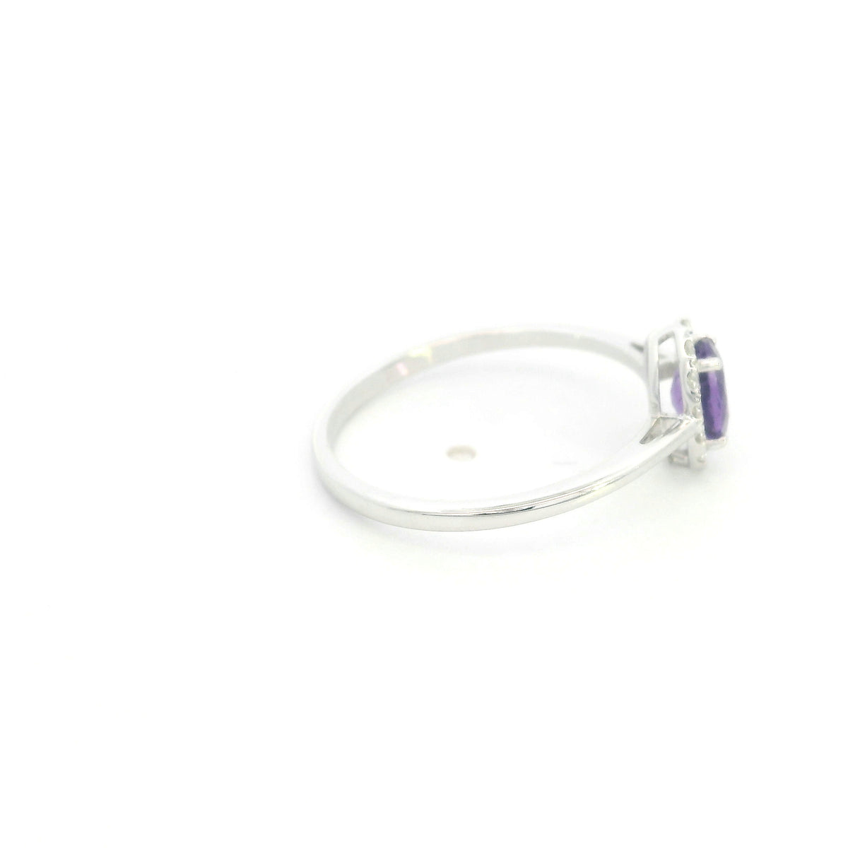 Oval amethyst ring with diamond halo in 18K white gold