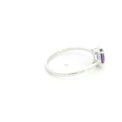 Oval amethyst ring with diamond halo in 18K white gold