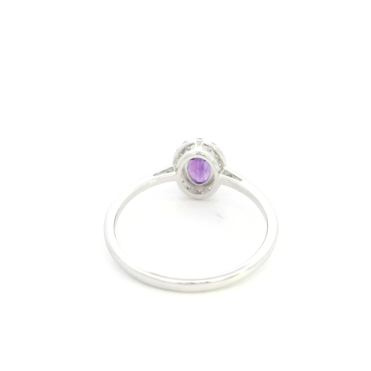 Oval amethyst ring with diamond halo in 18K white gold