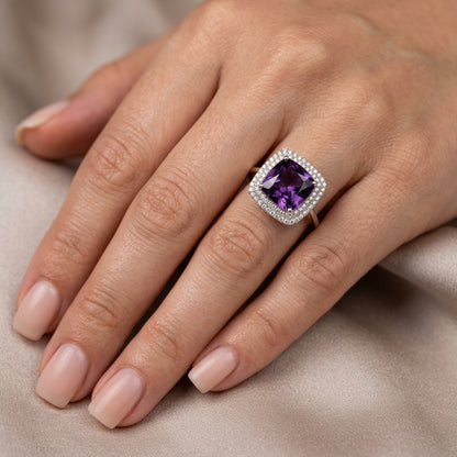 Cushion cut amethyst diamond halo ring in 18K white gold with double diamond halo