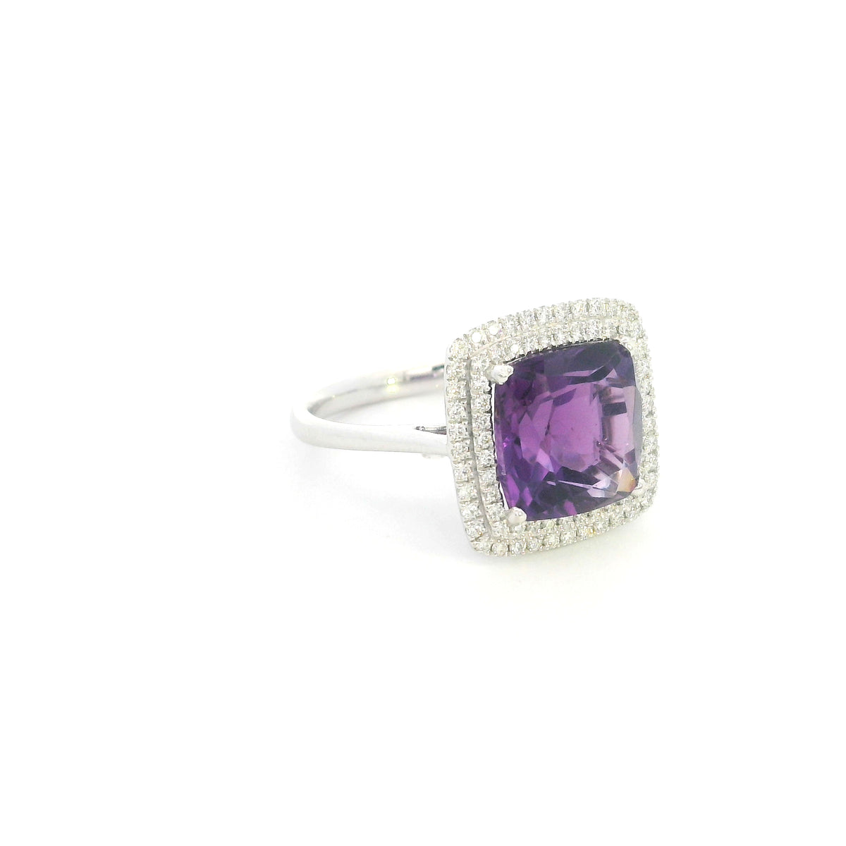 Cushion cut amethyst diamond halo ring in 18K white gold with double diamond halo