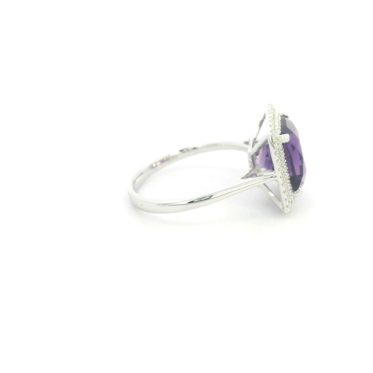 Cushion cut amethyst diamond halo ring in 18K white gold with double diamond halo
