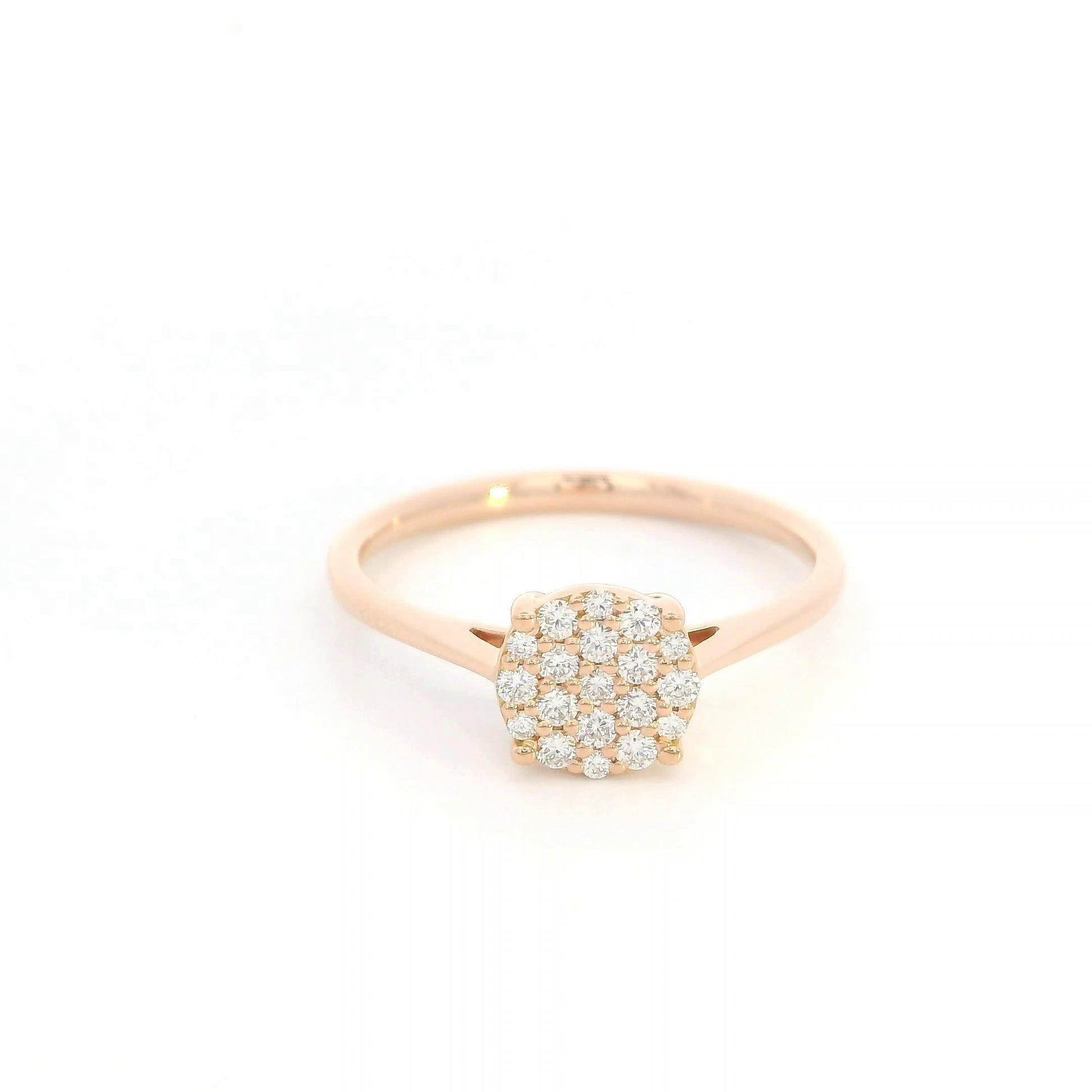 Diamond cluster ring in 18K rose gold featuring round brilliant diamonds arranged across a delicate polished band.
