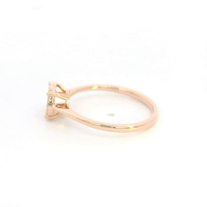 Diamond cluster ring in 18K rose gold featuring round brilliant diamonds arranged across a delicate polished band.