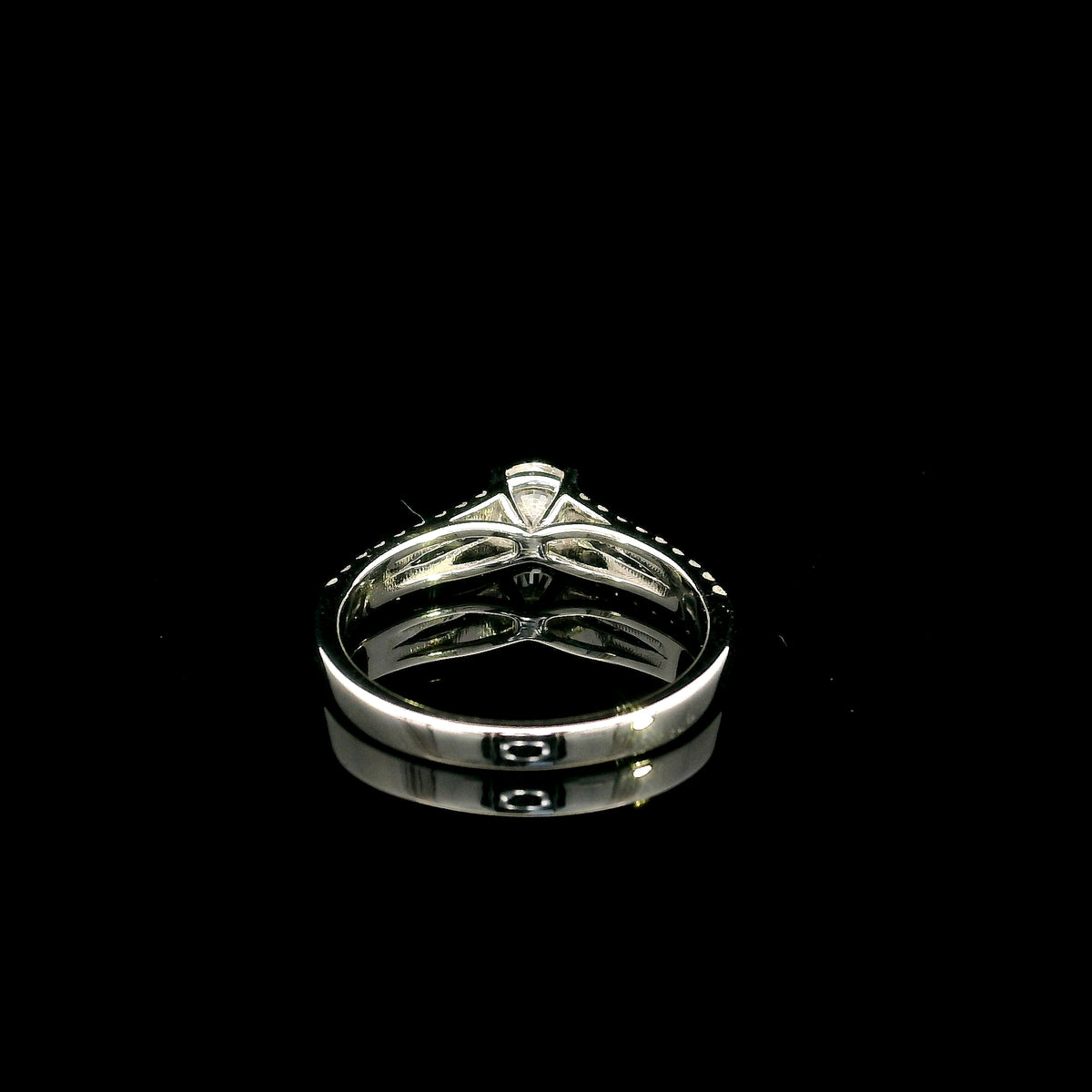 Round diamond split shank engagement ring in 18K white gold with diamond-set band